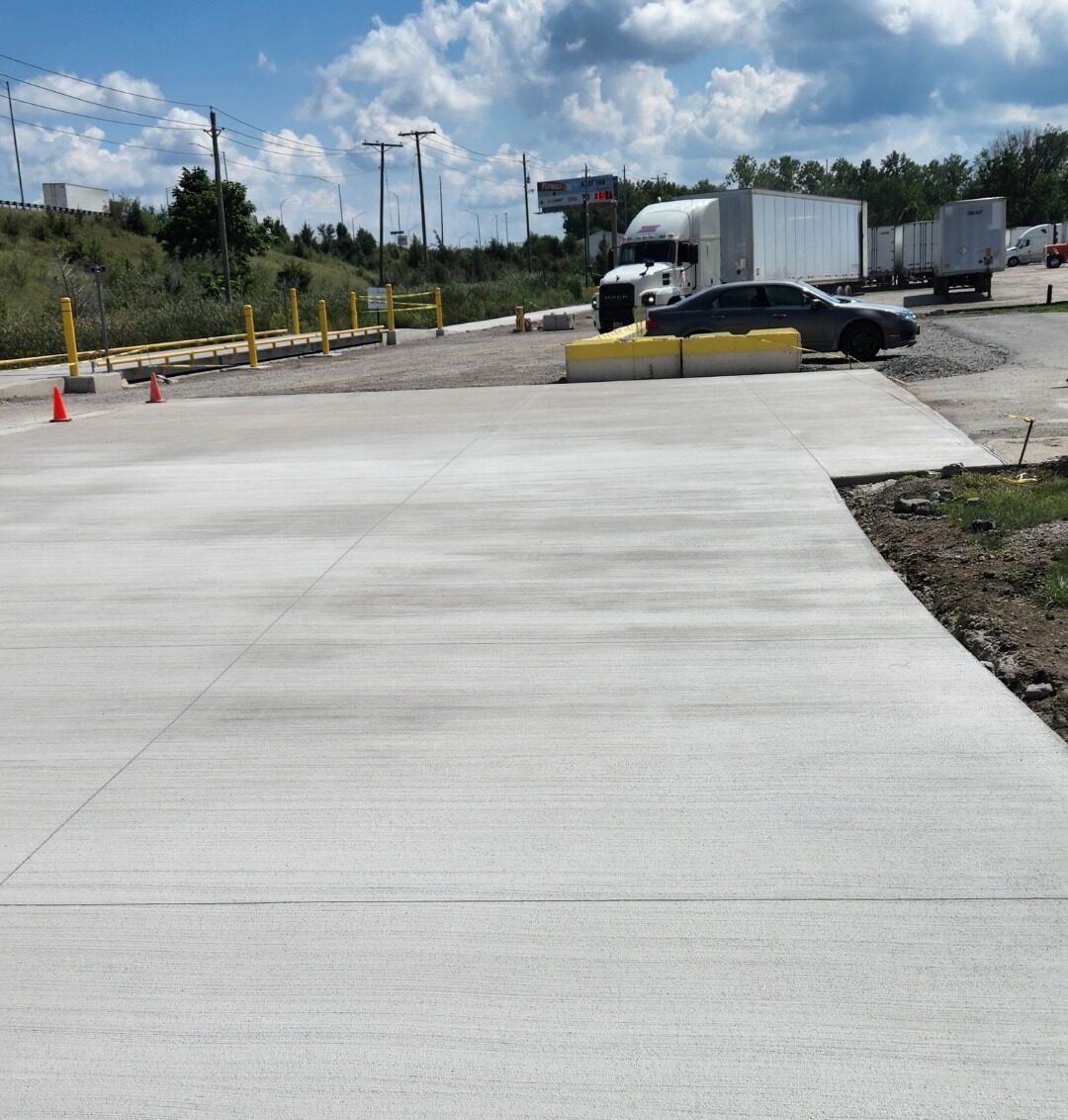 Freshly poured broom-finished concrete pavement at a commercial truck loading and parking area. Commercial concrete contractor in Leo-Cedarville. Commercial concrete contractor in Pierceton. Commercial concrete contractor in Wabash. Commercial concrete contractor in Roanoke. Commercial concrete contractor in Ligonier. Commercial concrete contractor in LaGrange.