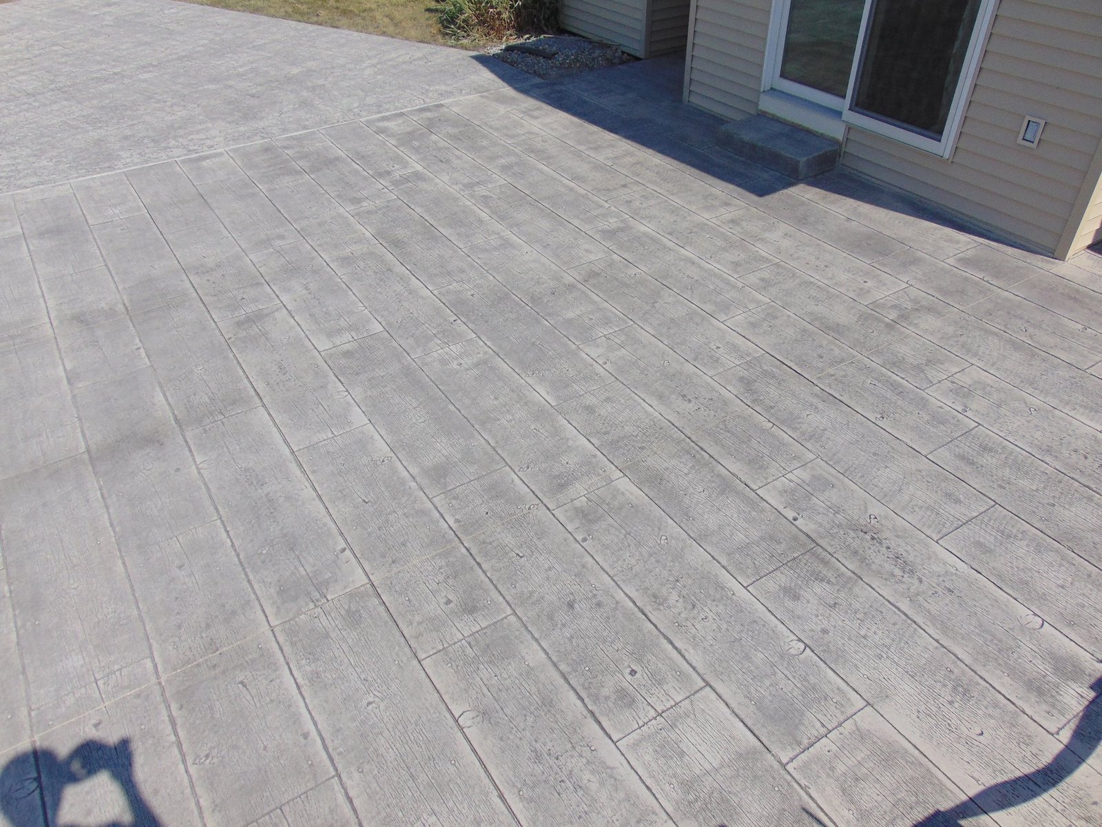Stamped concrete with a wooden print.